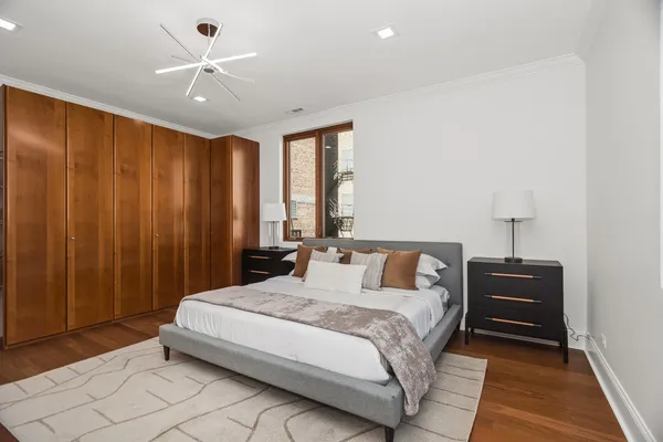 a bedroom with a bed and a table