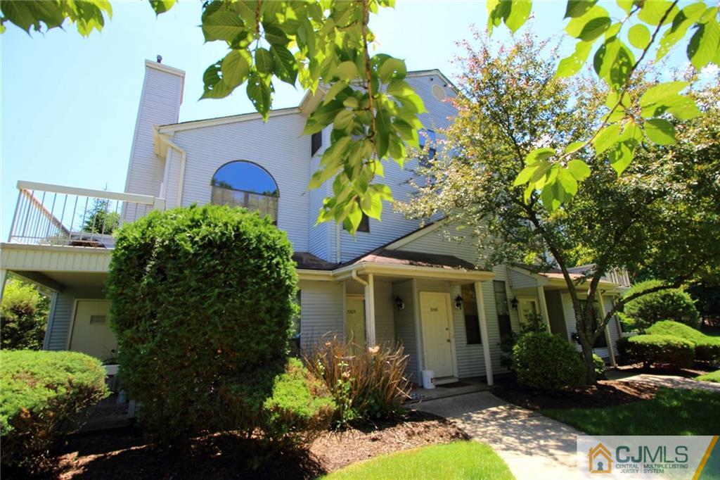 front view of a house with a garden