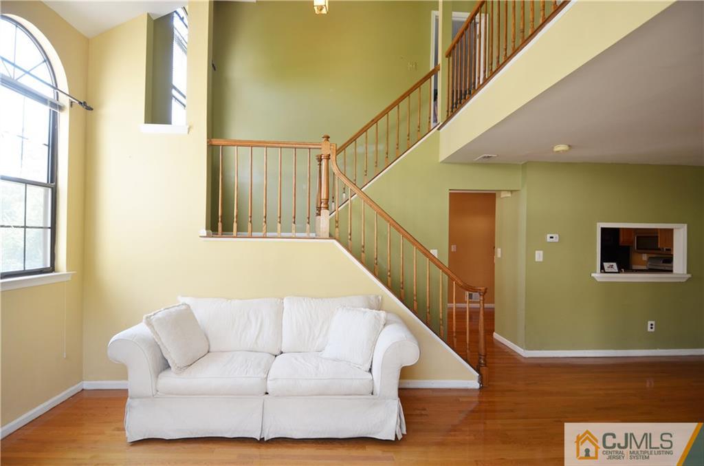 5206 Stonehedge Road Edison, NJ 08820 - Photo 4 of 13 a living room with furniture and stairs