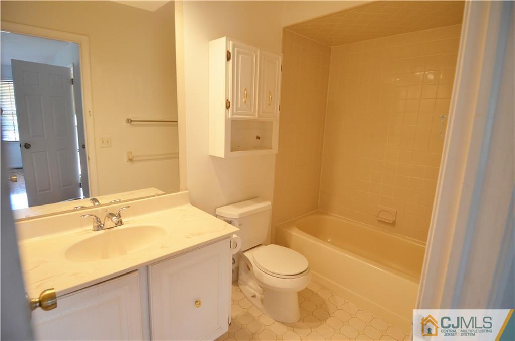 5206 Stonehedge Road Edison, NJ 08820 - Photo 8 of 13 a bathroom with a granite countertop sink toilet and shower