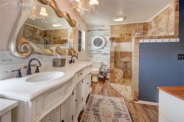 8084 Oliver Road Peyton, CO 80831 - Photo 16 of 33 Large master bath with custom vanity and custom shower!!