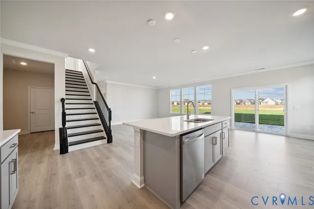 a kitchen with stove and cabinets