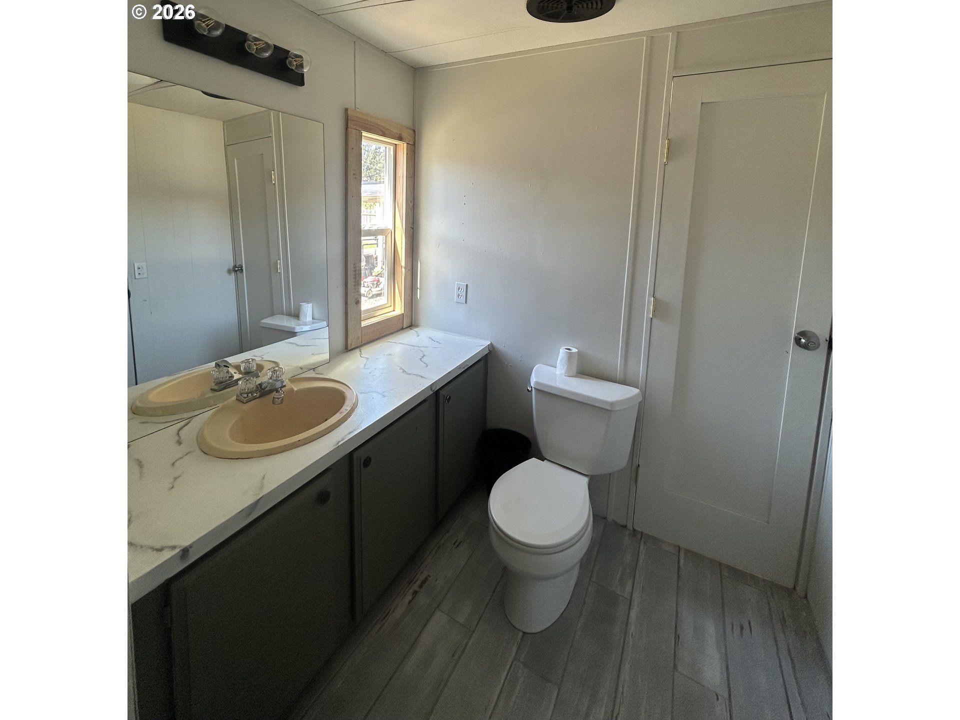 355 North 8th Street Lakeside, OR 97449 - Photo 16 of 22 a bathroom with a granite countertop sink toilet and shower