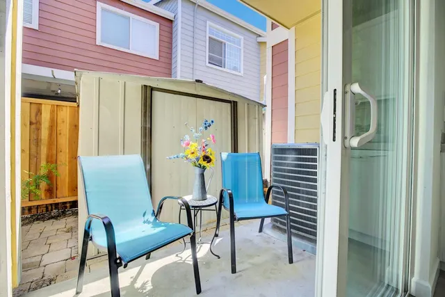 a view of an chairs and table in the balcony