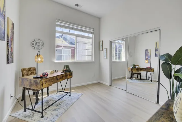 a workspace with furniture and window