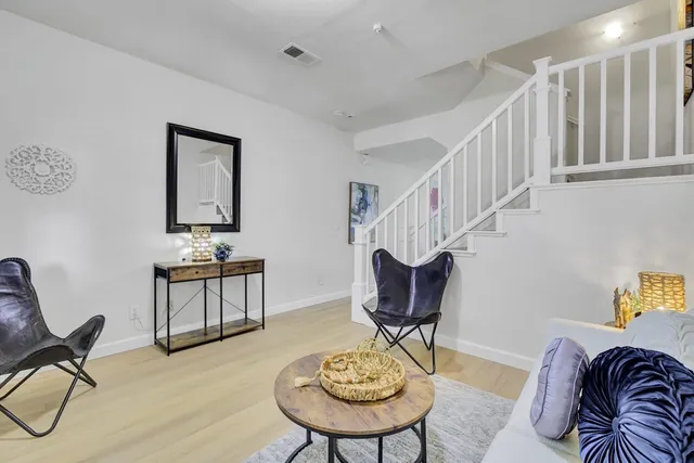 a living room with furniture and a chair