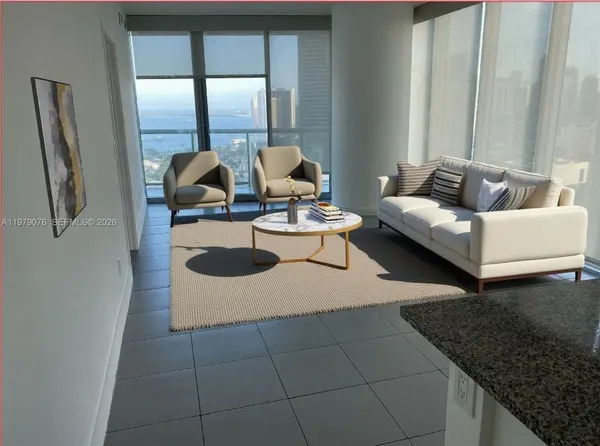 a living room with furniture and window