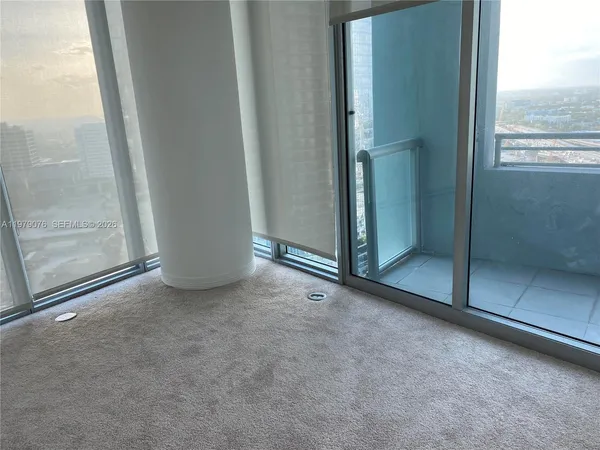 an empty room with sliding door
