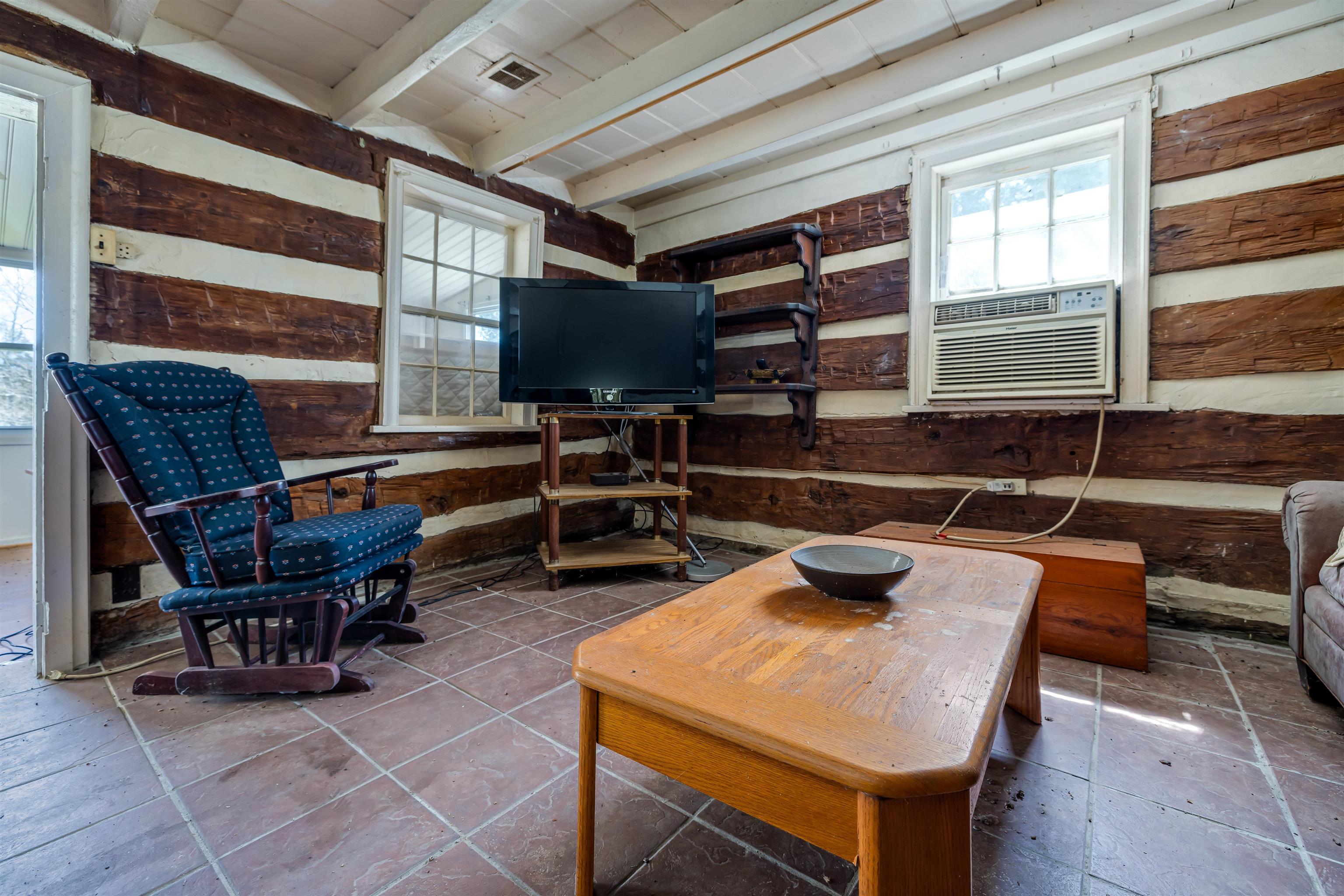 1476 Egypt Bend Road Luray, VA 22835 - Photo 15 of 74 a kitchen with a table chairs a barbeque and a stove