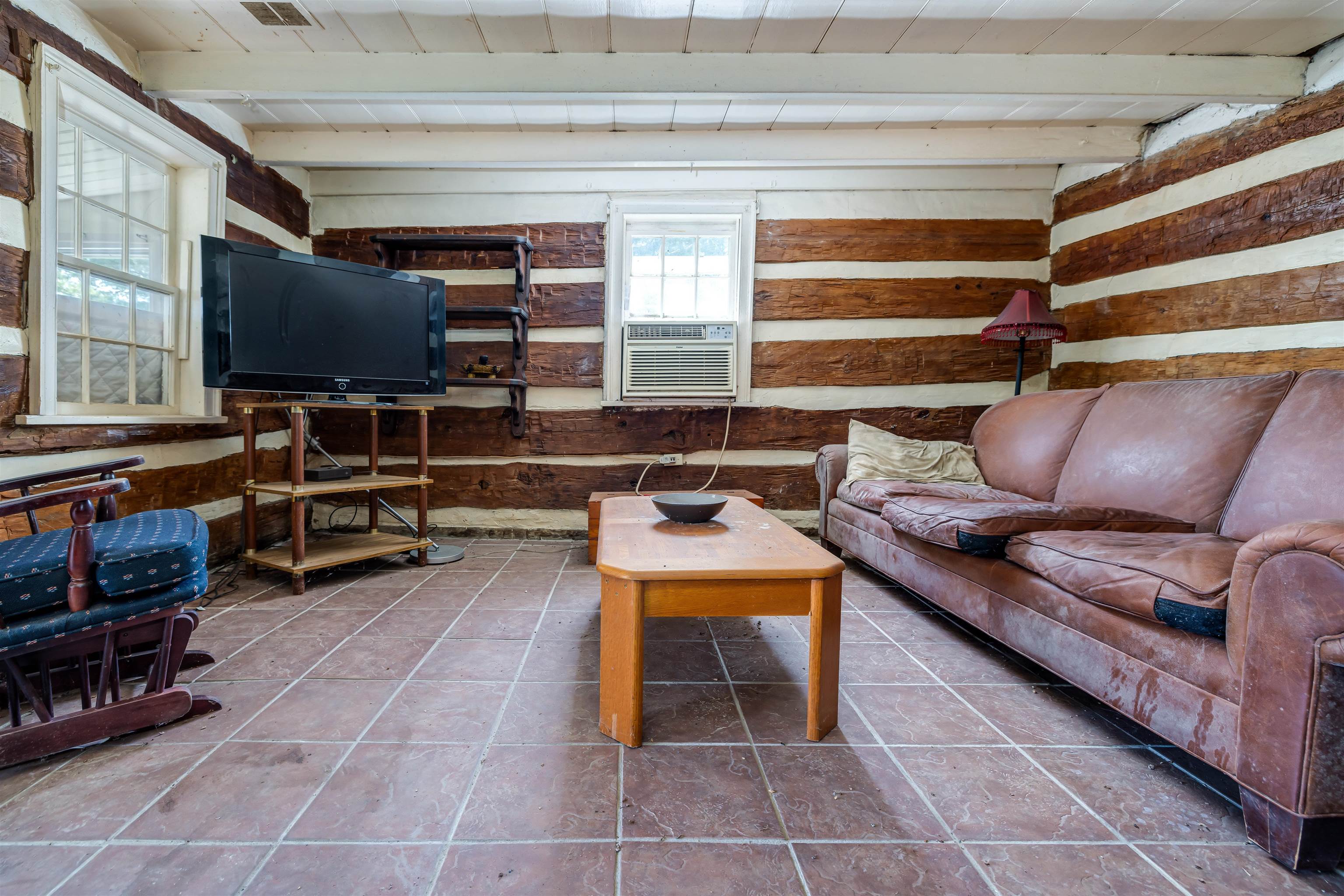 1476 Egypt Bend Road Luray, VA 22835 - Photo 16 of 74 a living room with furniture a flat screen tv and gym equipment