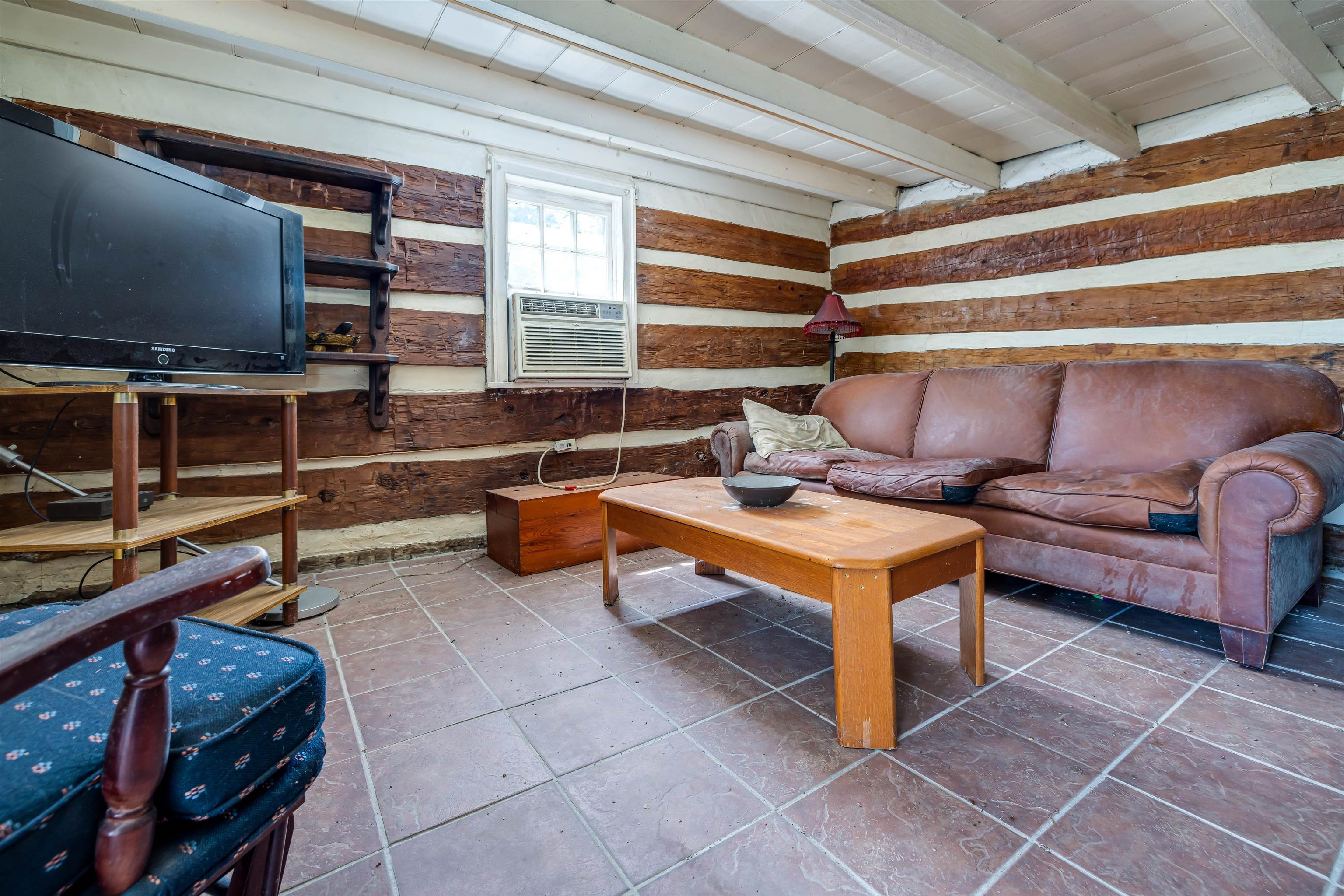 1476 Egypt Bend Road Luray, VA 22835 - Photo 17 of 74 a living room with furniture a flat screen tv and gym equipment