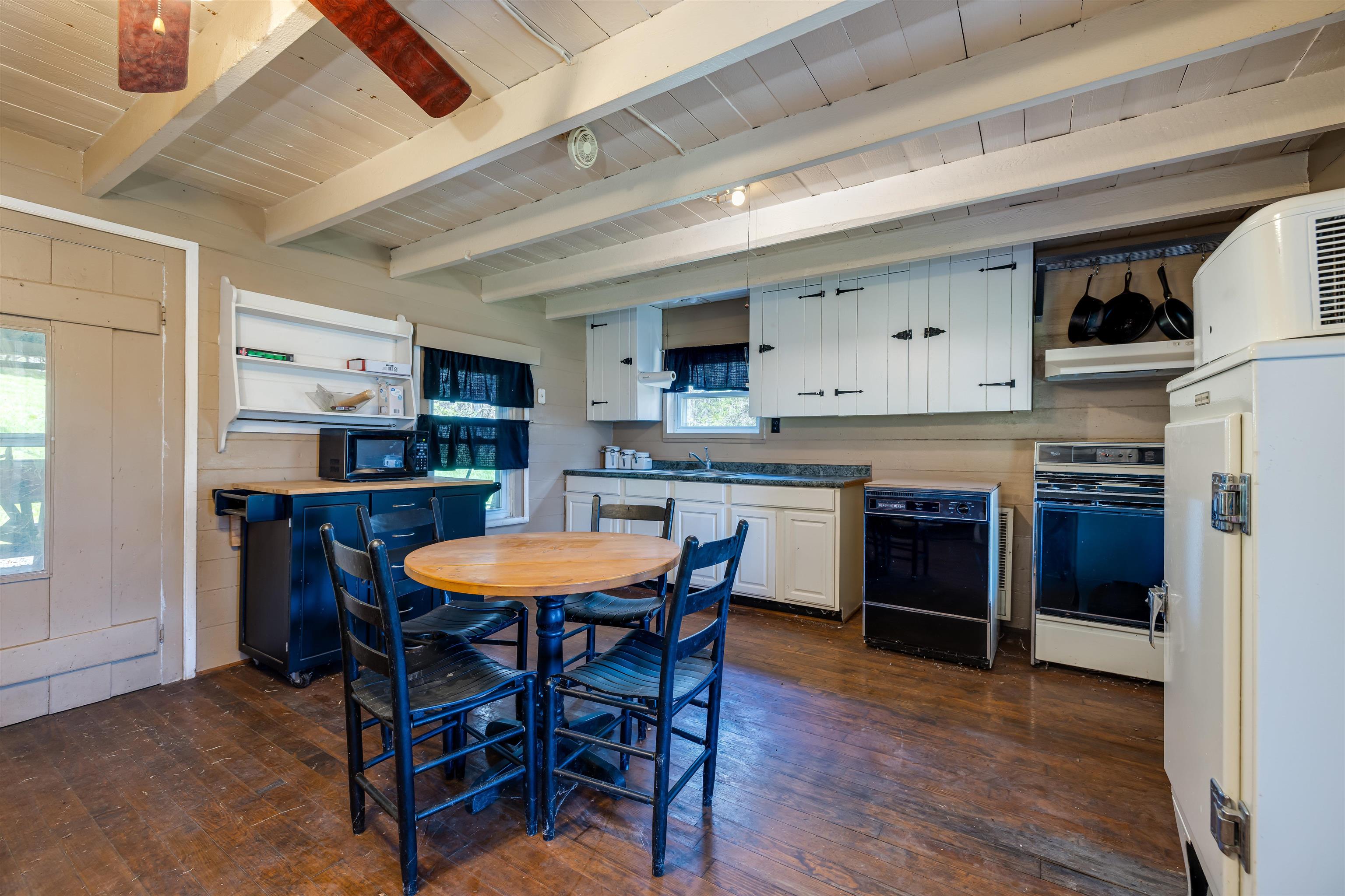 1476 Egypt Bend Road Luray, VA 22835 - Photo 4 of 74 a kitchen with stainless steel appliances granite countertop a kitchen island a stove a table and chairs