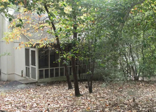 a backyard of a house with lots of green space