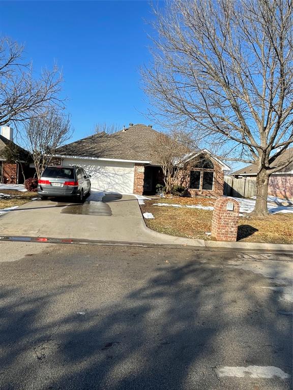 2620 John Drive Denton, TX 76207 - Photo 2 of 3 a view of street with parked cars