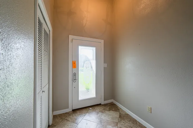 an empty room with windows