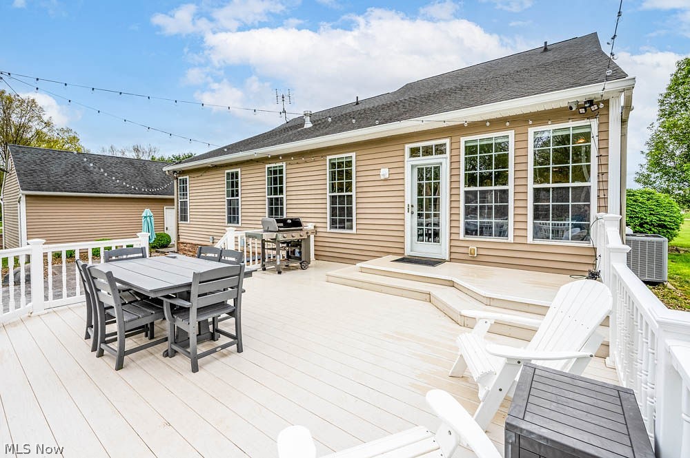 6787 South Palmyra Road Canfield, OH 44406 - Photo 26 of 30 Expansive rear deck featuring light-toned decking, white railings, and direct access to the interior via a full-lite door