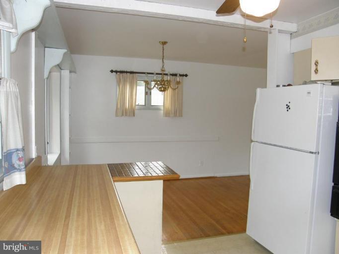 17 West Timonium Road Lutherville-Timonium, MD 21093 - Photo 5 of 17 Kitchen opens to dining room.