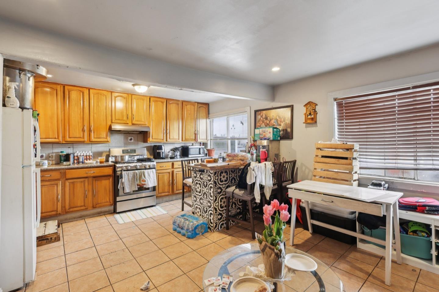 44 Patton Street San Francisco, CA 94110 - Photo 16 of 46 a living room filled with furniture and kitchen view