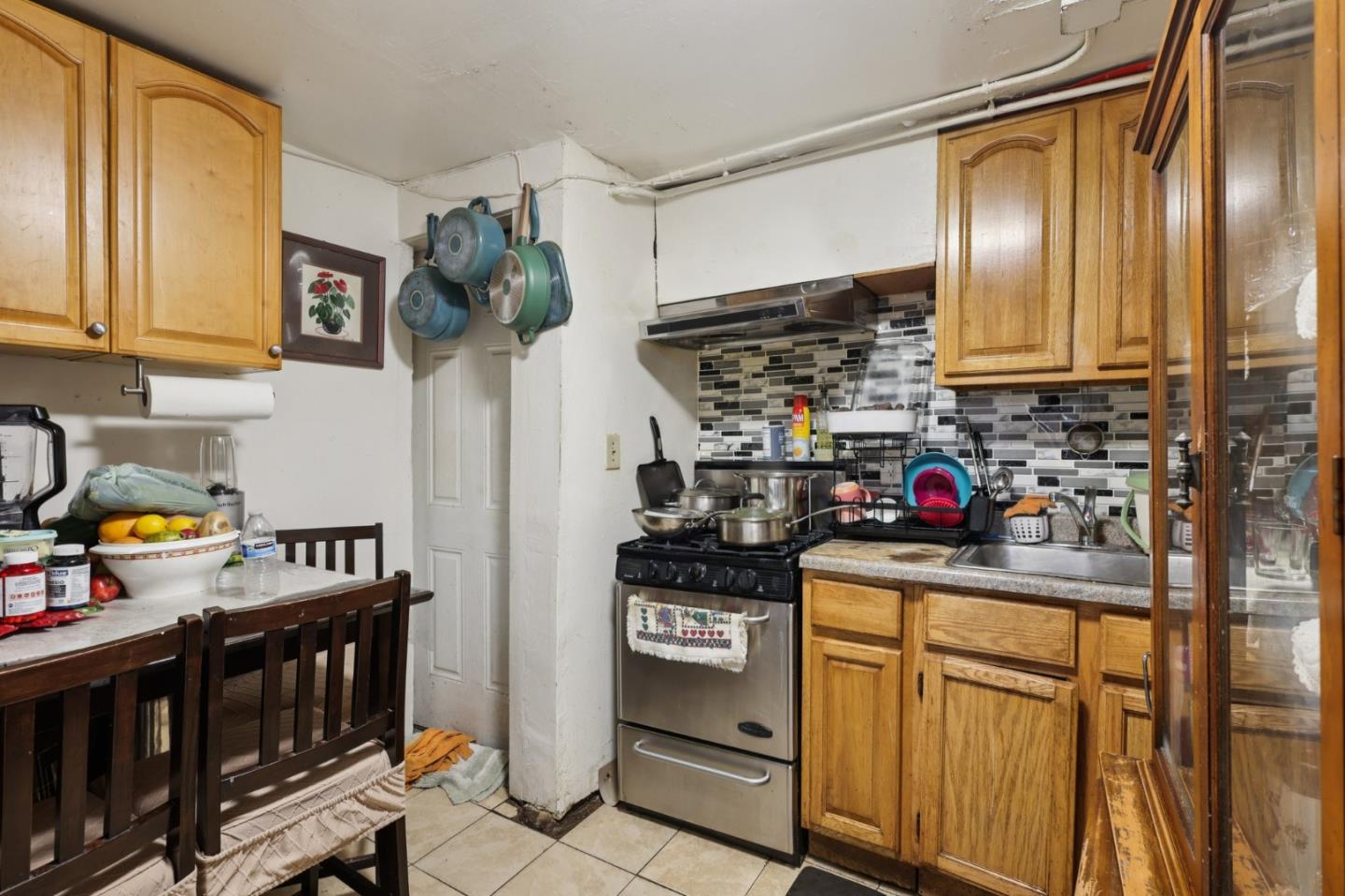 44 Patton Street San Francisco, CA 94110 - Photo 19 of 46 a kitchen with stainless steel appliances granite countertop a refrigerator and a stove top oven