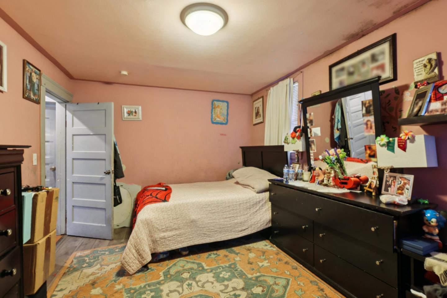 44 Patton Street San Francisco, CA 94110 - Photo 22 of 46 a bedroom with a bed and a dresser