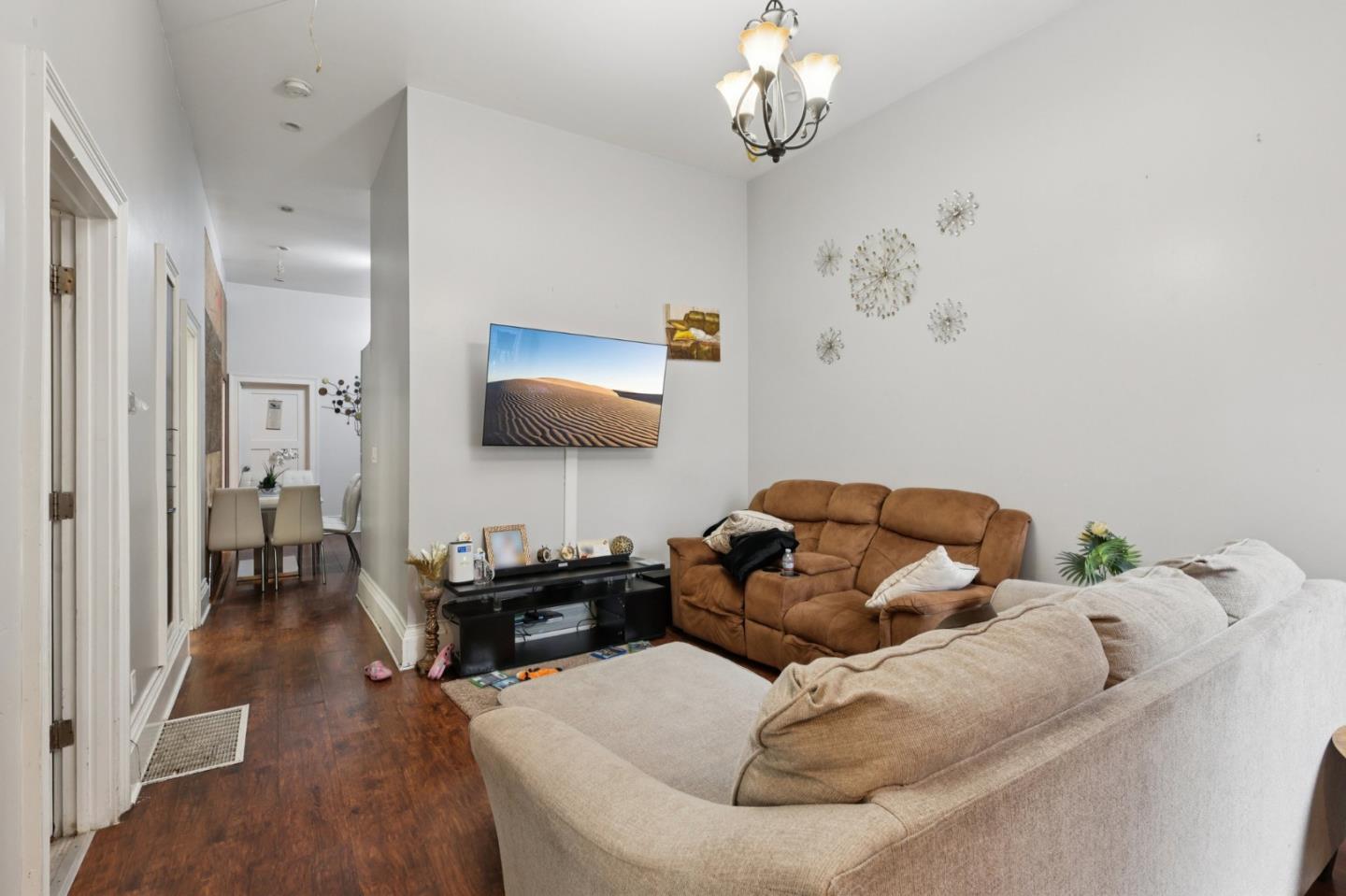 44 Patton Street San Francisco, CA 94110 - Photo 5 of 46 a living room with furniture and a flat screen tv