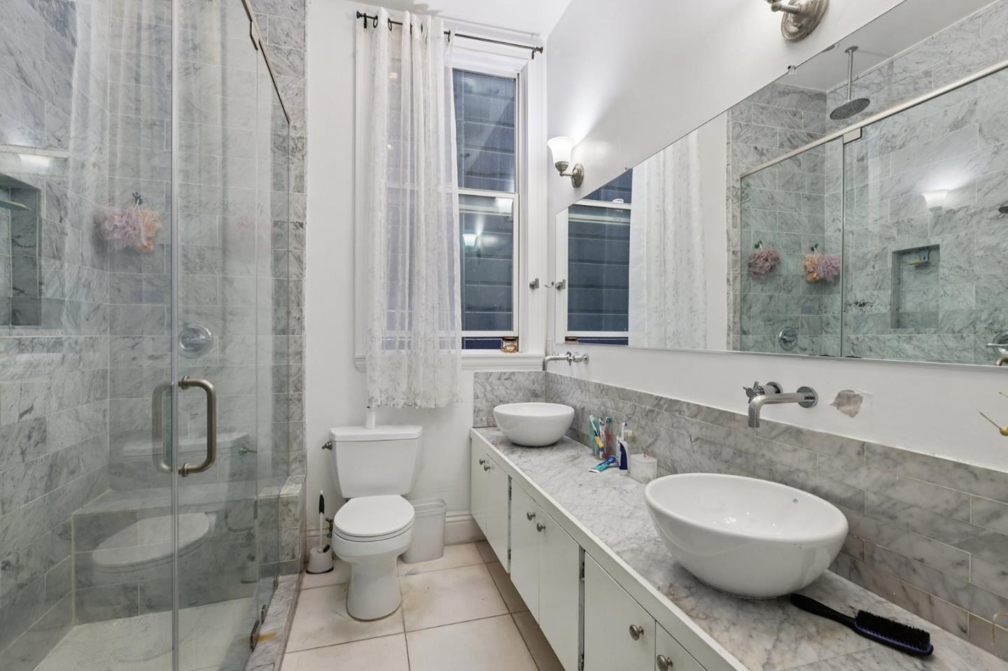 44 Patton Street San Francisco, CA 94110 - Photo 9 of 46 a bathroom with a granite countertop sink toilet a mirror and shower