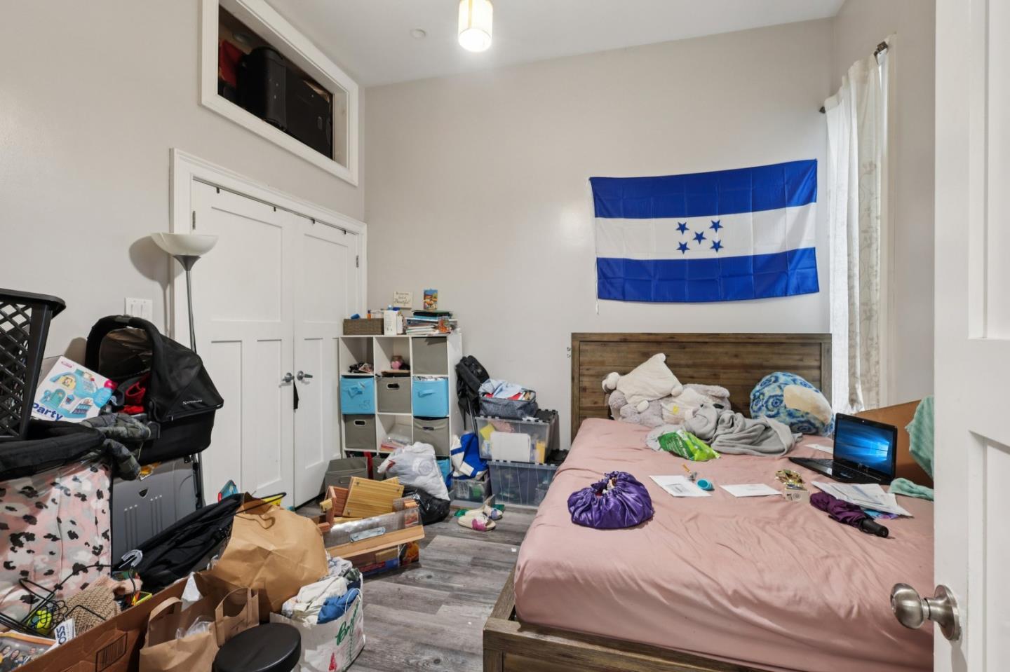 44 Patton Street San Francisco, CA 94110 - Photo 10 of 46 a bedroom with furniture and a lamp