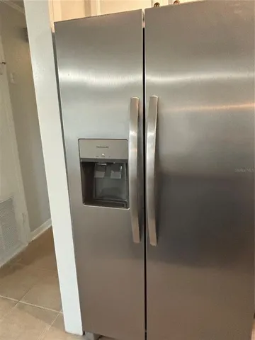 a kitchen with a granite countertop sink and stove