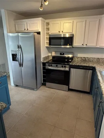 a view of a livingroom with a staircase
