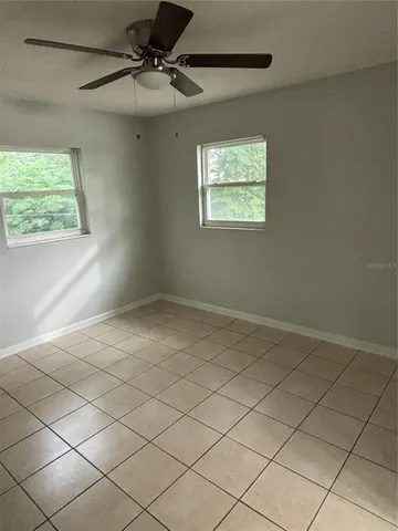 a view of an empty room and a window