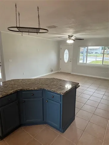 a kitchen with a sink a vanity and cabinets