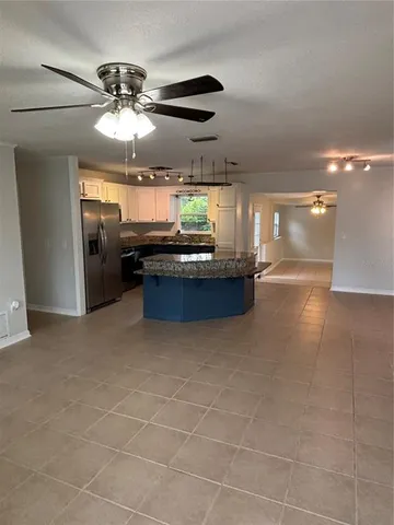 a lobby with furniture and chandelier