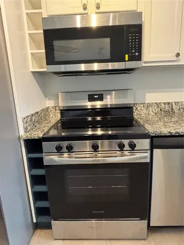 a bathroom with a shower and a mirror