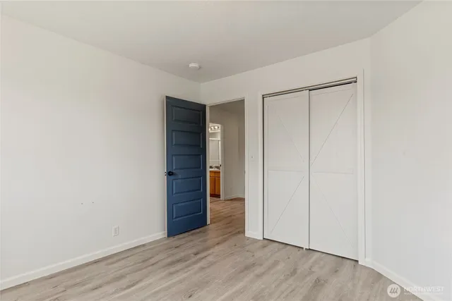 a view of staircase with railing and a chandelier