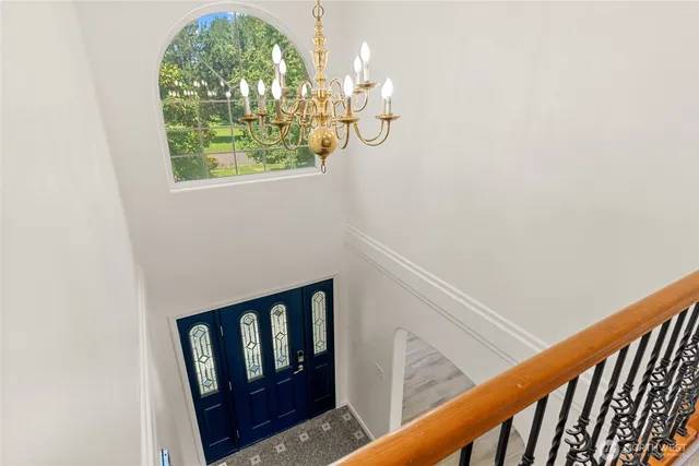 a view of a house with a tree