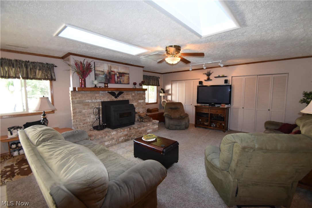 4466 Burkey Road Youngstown, OH 44515 - Photo 17 of 28 Large living room also has a wood burning stove, keeps everything toasty warm.