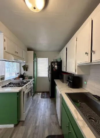 a kitchen with a stove and a sink