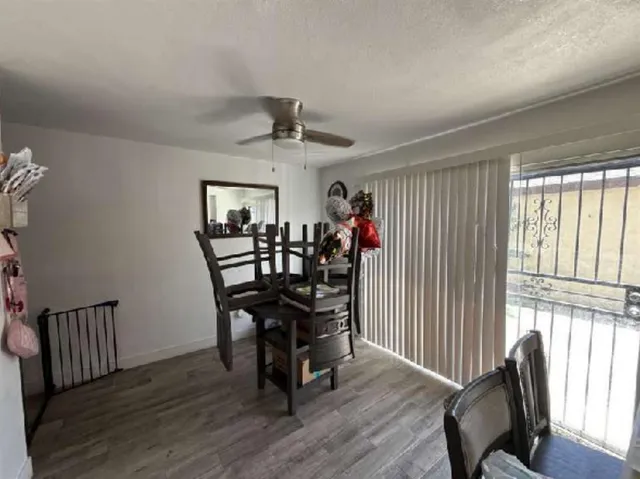 a view of a dining room with furniture and window
