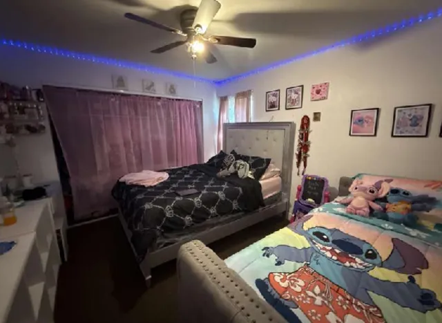 a bedroom with a bed and furniture