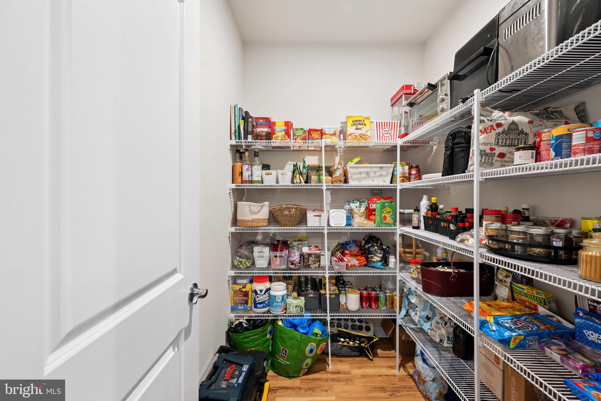 13506 Innovation Station Loop, Unit 2B Herndon, VA 20171 - Photo 13 of 32 a room with lots of different colored cloths