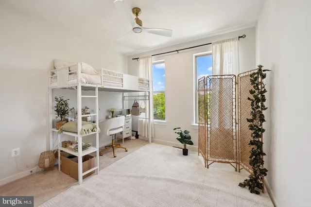 a bedroom with furniture and a window