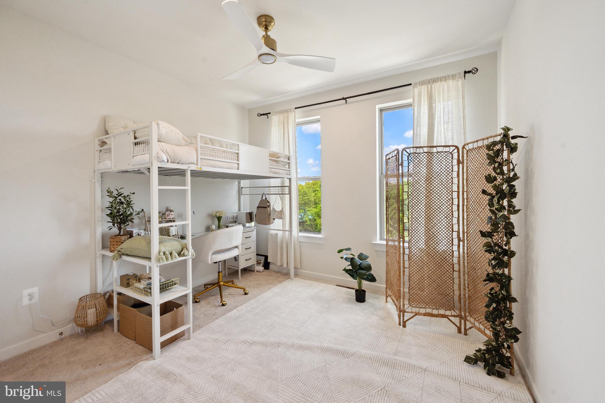 13506 Innovation Station Loop, Unit 2B Herndon, VA 20171 - Photo 17 of 32 a bedroom with furniture and a window