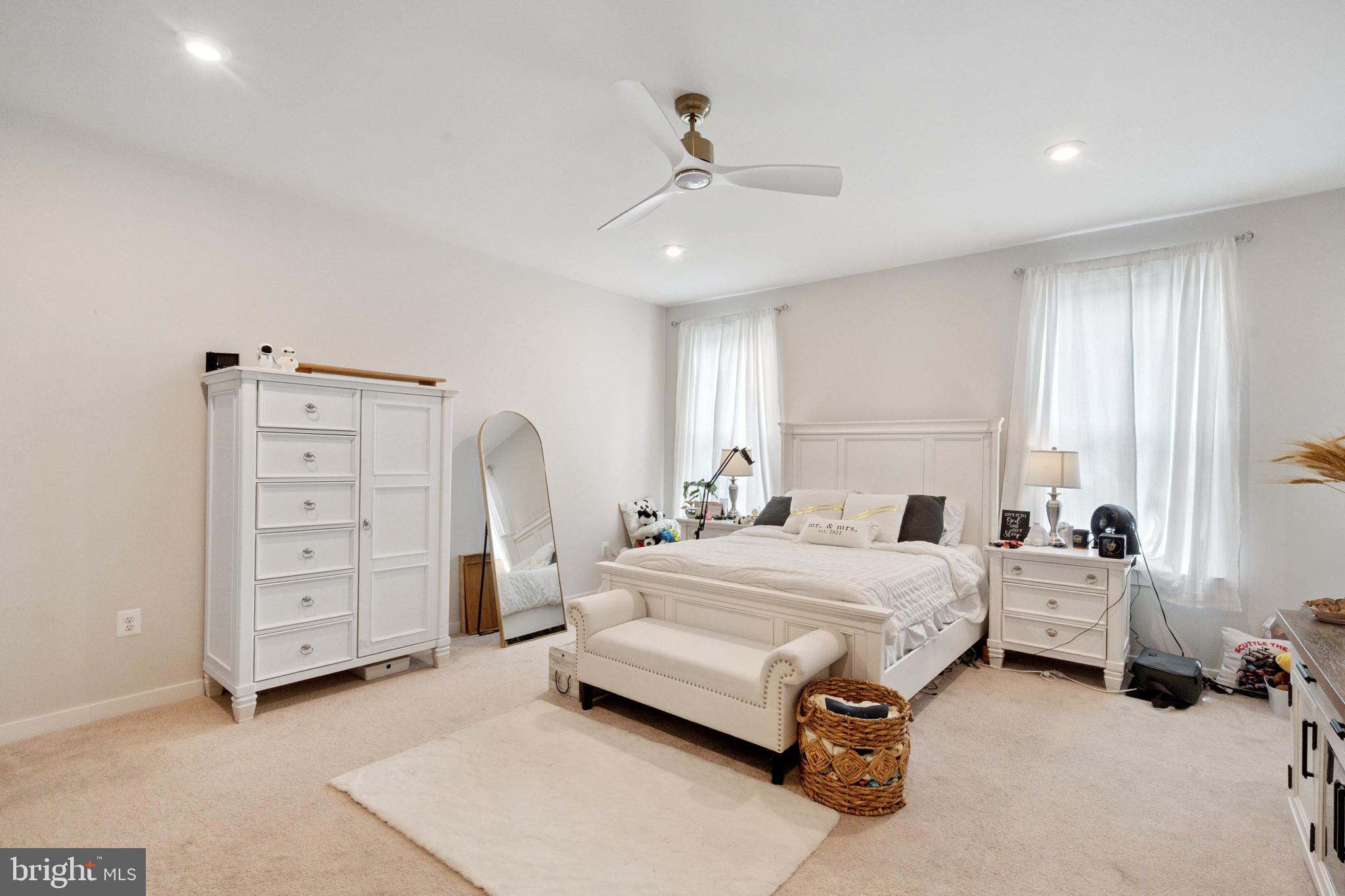13506 Innovation Station Loop, Unit 2B Herndon, VA 20171 - Photo 19 of 32 a spacious bedroom with a bed and a cabinets