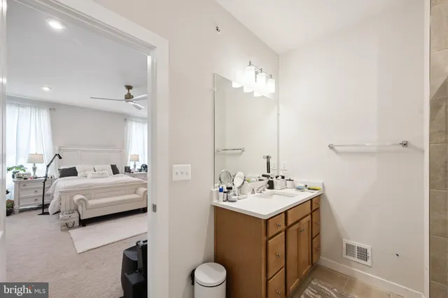 a bathroom with a double vanity sink and a mirror