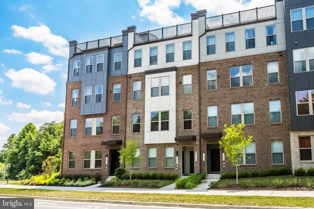 a front view of a multi story residential apartment building