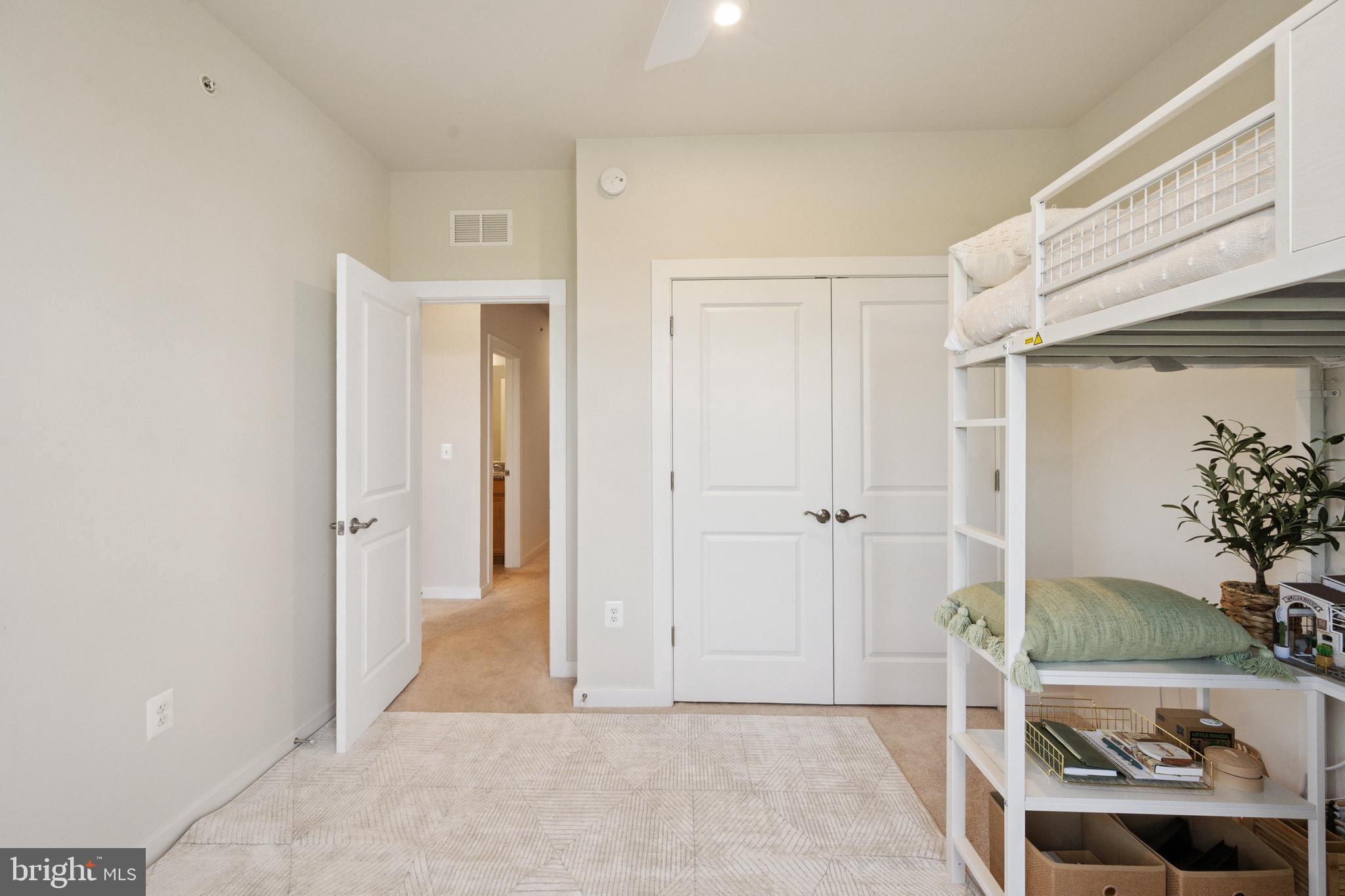 13506 Innovation Station Loop, Unit 2B Herndon, VA 20171 - Photo 25 of 32 a view of a livingroom with wooden floor and furniture