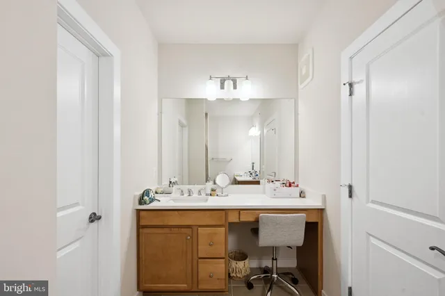 a white toilet sitting next to a bathroom sink