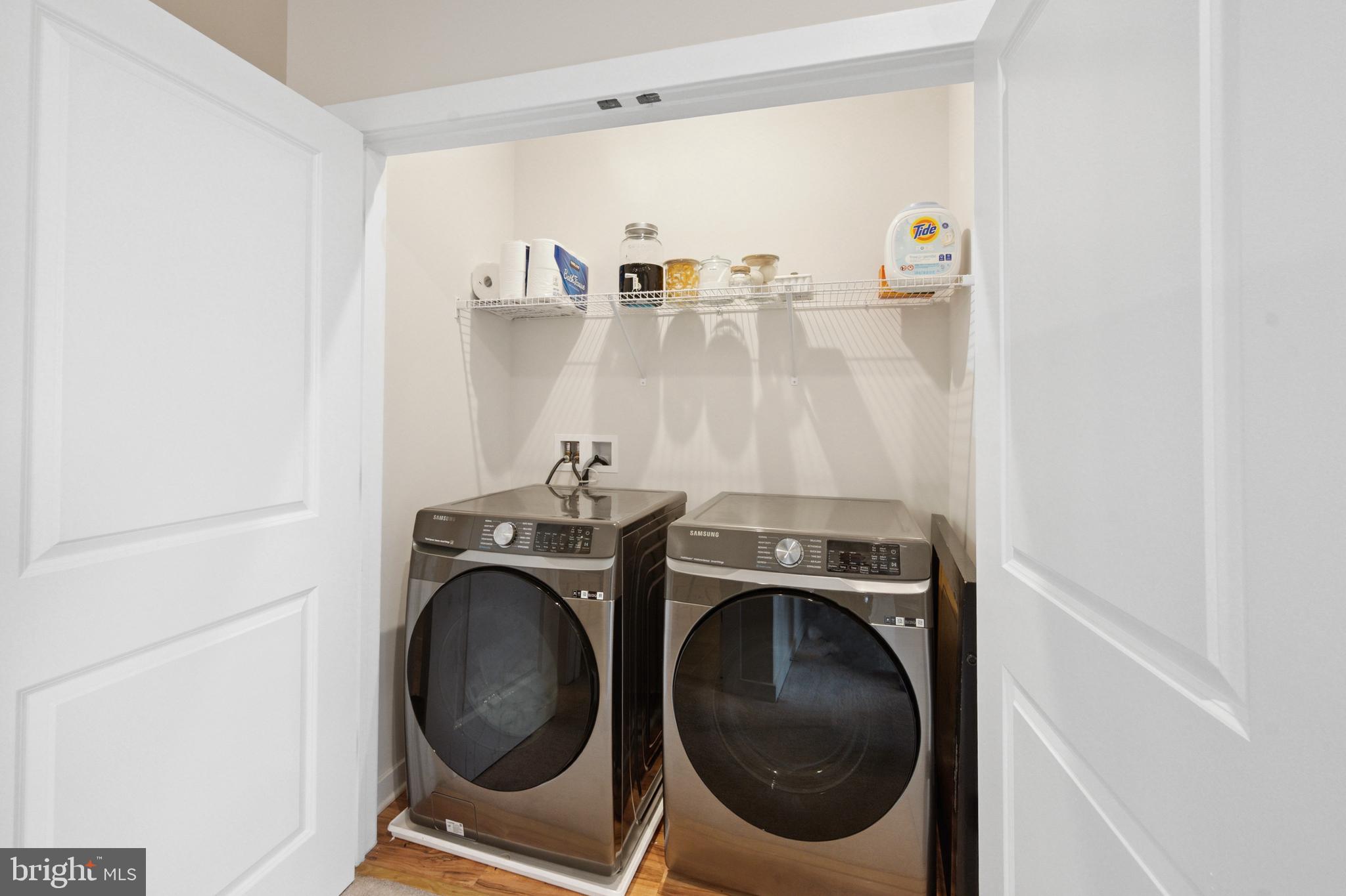 13506 Innovation Station Loop, Unit 2B Herndon, VA 20171 - Photo 31 of 32 a utility room with dryer and washer