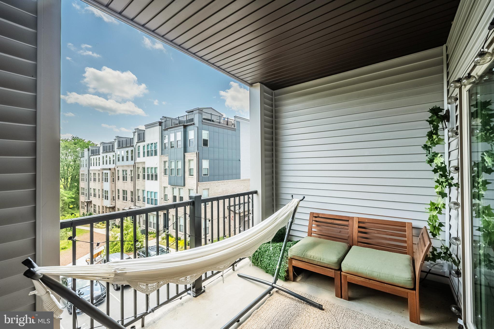 13506 Innovation Station Loop, Unit 2B Herndon, VA 20171 - Photo 32 of 32 a view of a balcony with furniture
