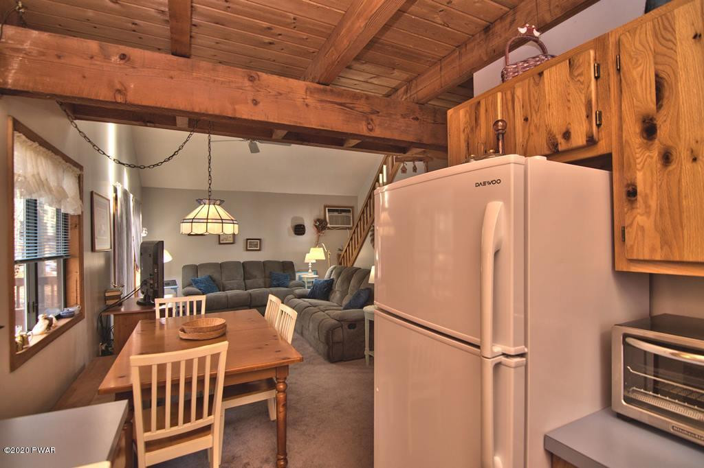27-2690 Boulder Road Lake Ariel, PA 18436 - Photo 6 of 48 a view of a kitchen with furniture and a chandelier